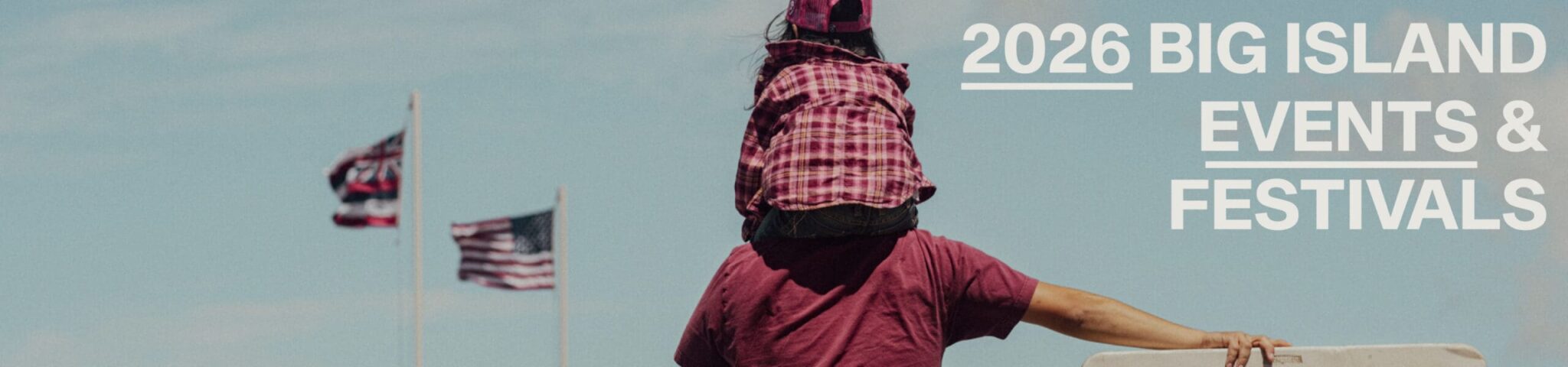 Back of a Man with a child on his shoulders, Hawaiian and American flag on the distance