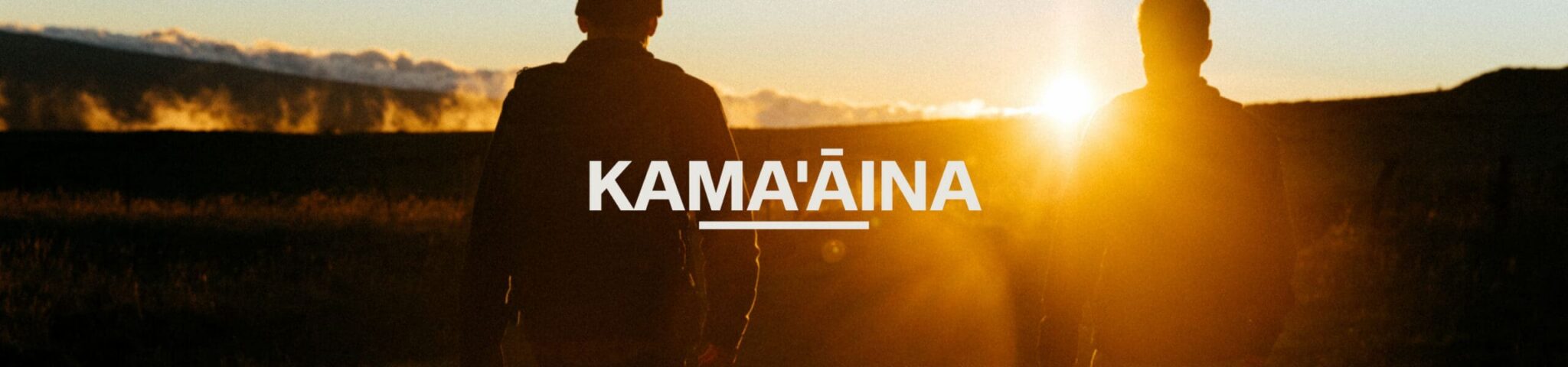 2 people walking to the sunset in mauna kea hawaii